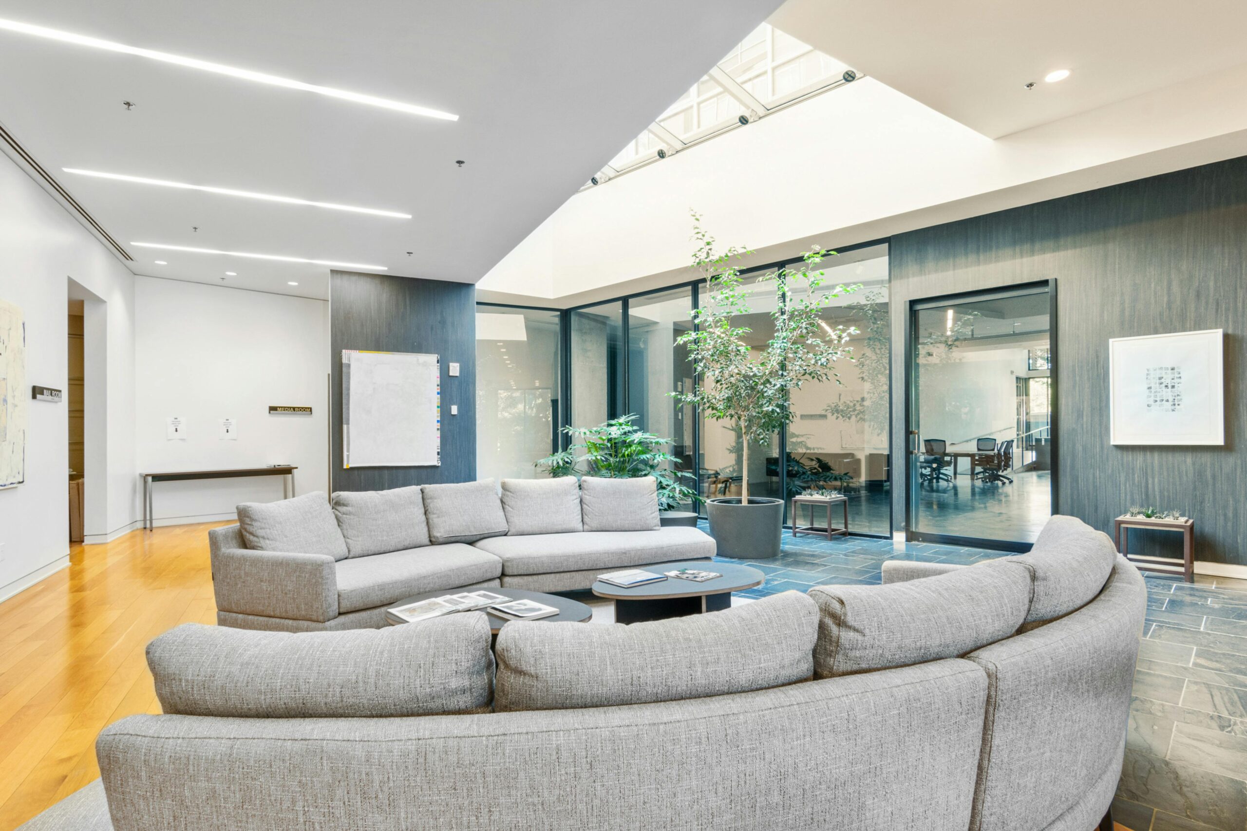 Immaculate lobby waiting room with stylish seating and modern decor, showcasing the exceptional standards of a commercial cleaning service for welcoming environments.